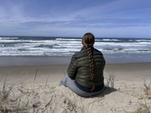 sitting at beach on dune